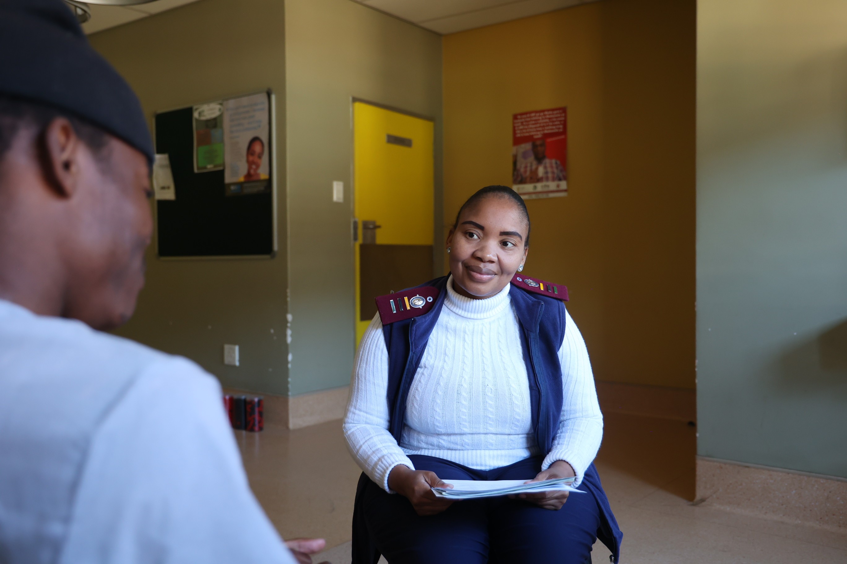 A healthcare worker speaking with a patient