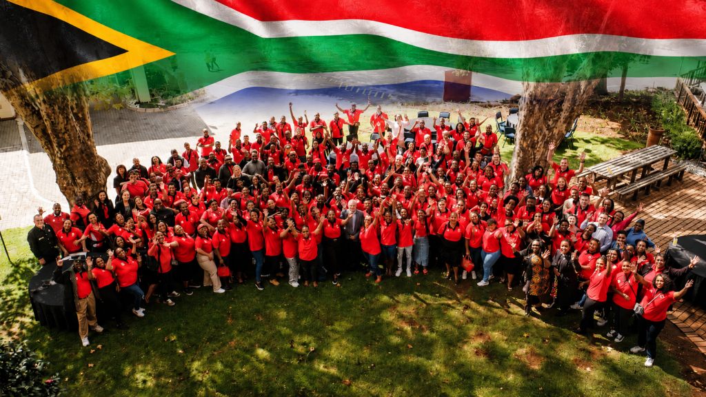 Aurum South Africa team, with the South African flag